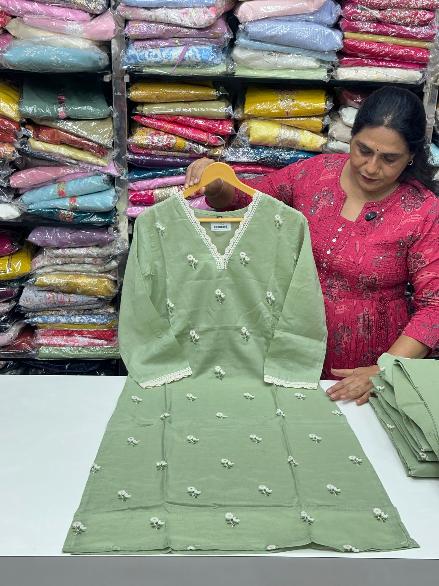 Classy and rich 3 piece kurta set in premium mul cotton fabric with doodle thread work detailing all over the kurta in pista color elegant and comfortable article with lining