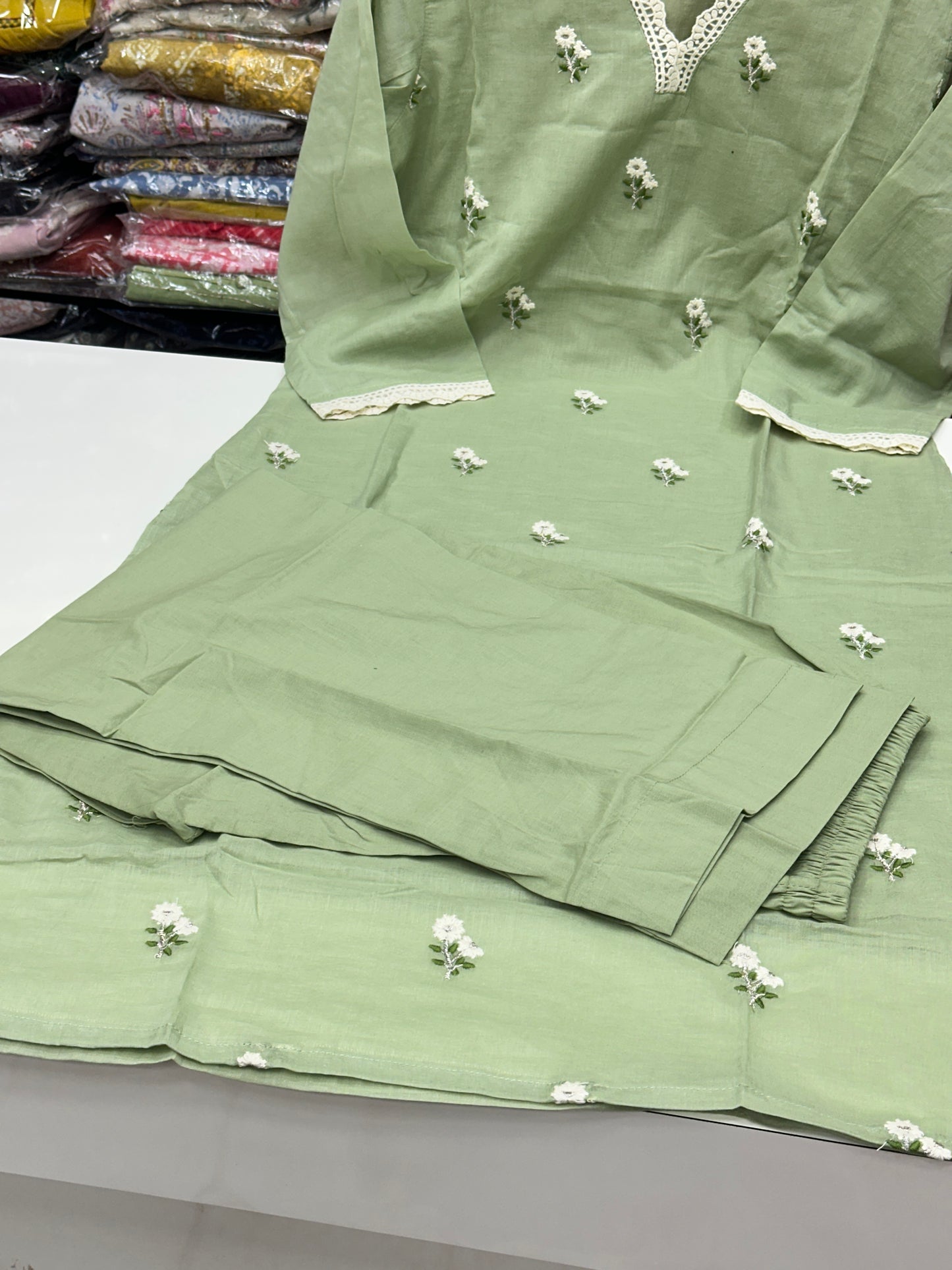 Classy and rich 3 piece kurta set in premium mul cotton fabric with doodle thread work detailing all over the kurta in pista color elegant and comfortable article with lining